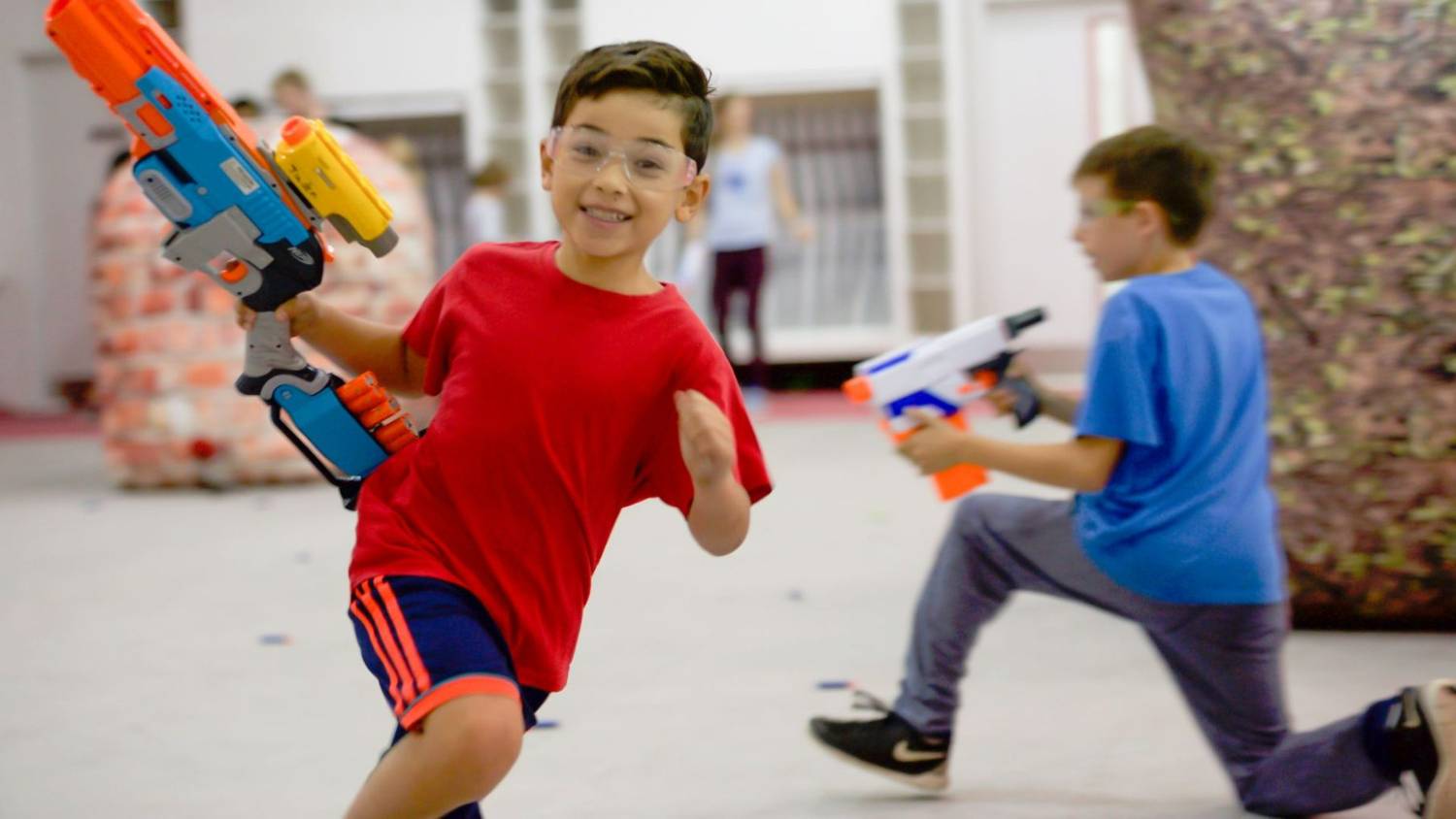 Two boys playing nerf gun